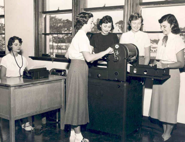 Students using office equipment in Secretarial Science class