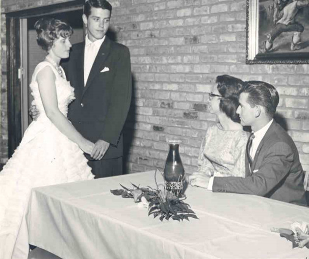 Couples talk at a formal dance