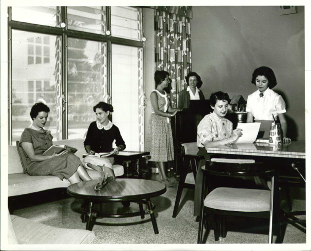 Students socialize in the Day Students Lounge in the Fine Arts Quadrangle
