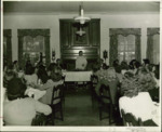 Father Cyril Burke and John Thompson at the Founders Day celebration in LaVoie Hall dining room