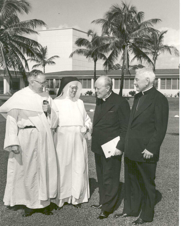 Mother Gerald Barry talks to clergy members attending the dedication and opening of Fine Arts buildings