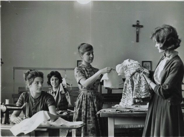 Members of the Home Economics Club evaluate their sewing