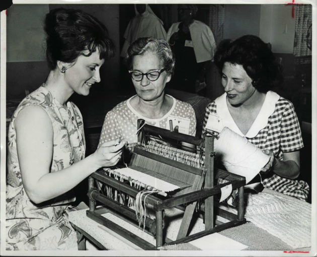 Barry alums practice weaving on a loom