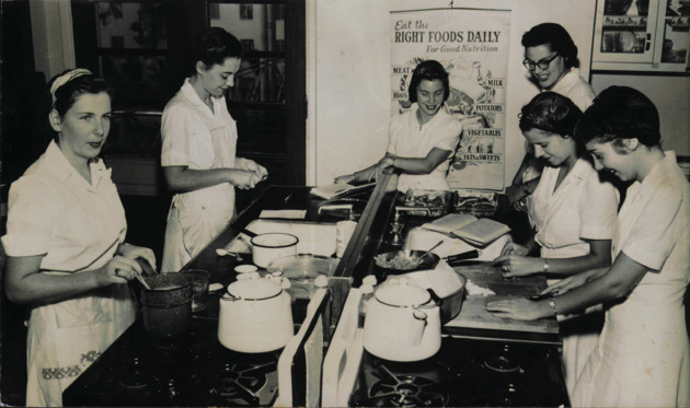 Home Economics students in a Food Nutrition class cooking meals in the Foods Laboratory