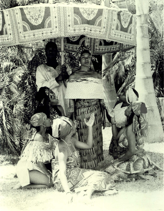 Yvonne Goodridge and dance students in African traditional costume pose in the Fine Arts Quadrangle