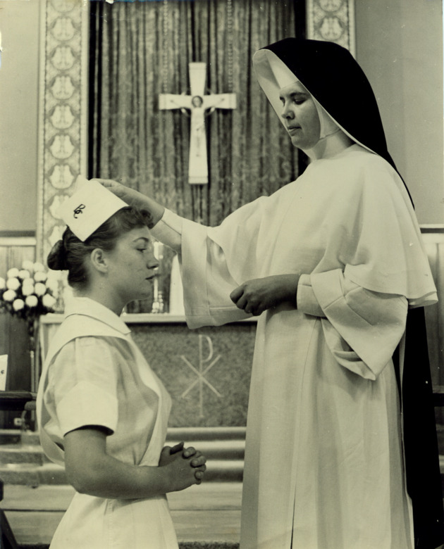 Sister Loretta Michael capping a nursing student