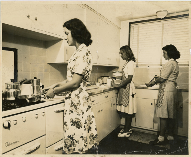 Students cooking in the Practice House kitchen