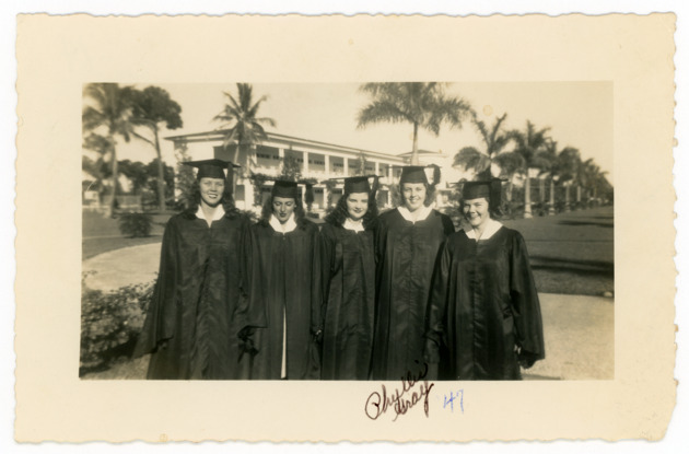 Students wearing academic regalia at their graduation ceremony