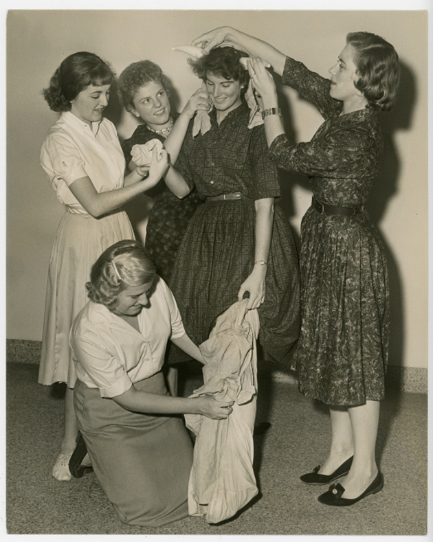 Students trying some props on classmate Jane Gallagher
