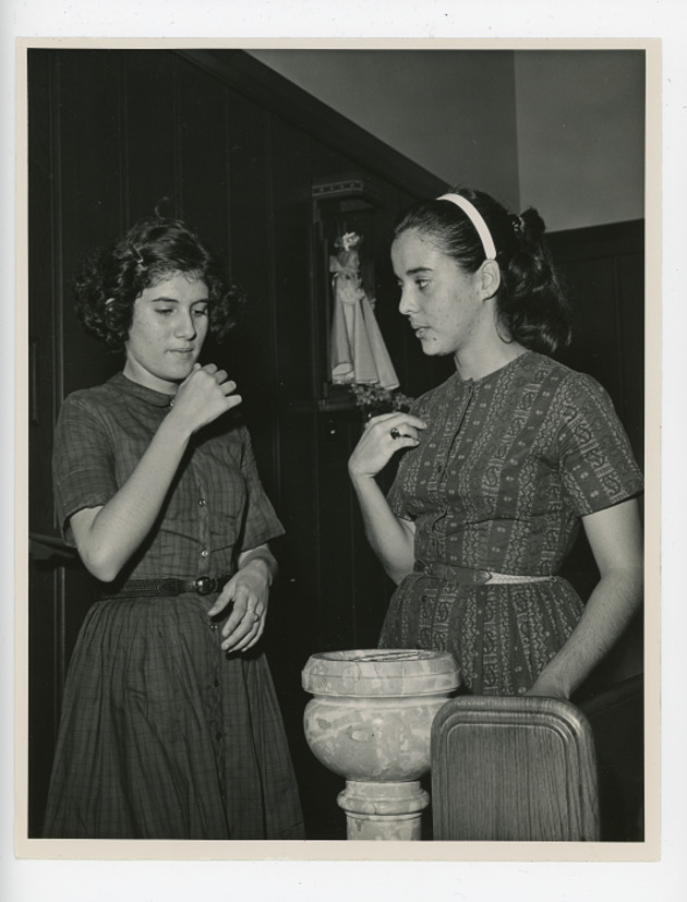Maria Hernandez giving CCD instruction to Barbara Ferrer