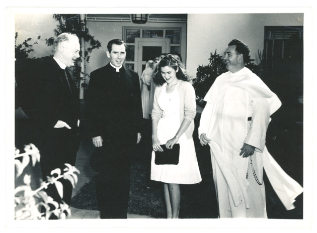 Monsignor Fulton Sheen speaks with a student in his visit to the campus, 1946